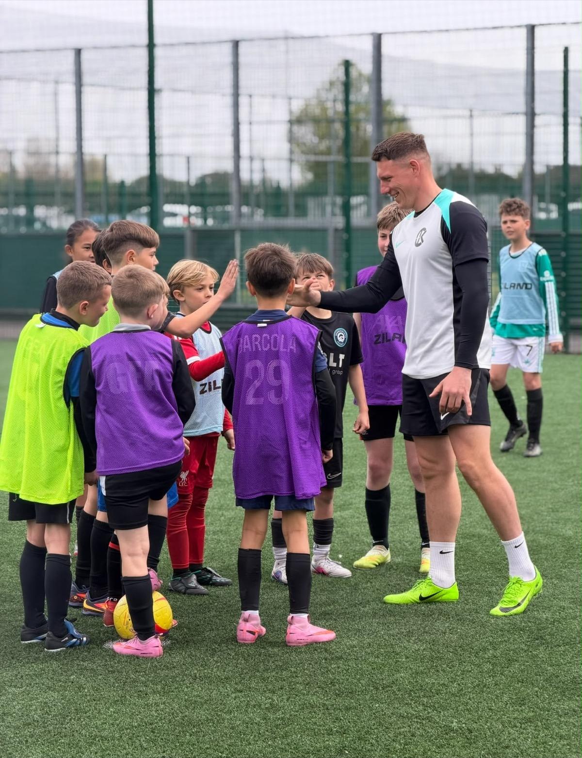 Children playing a match at a Bournemouth Ballers summer camp