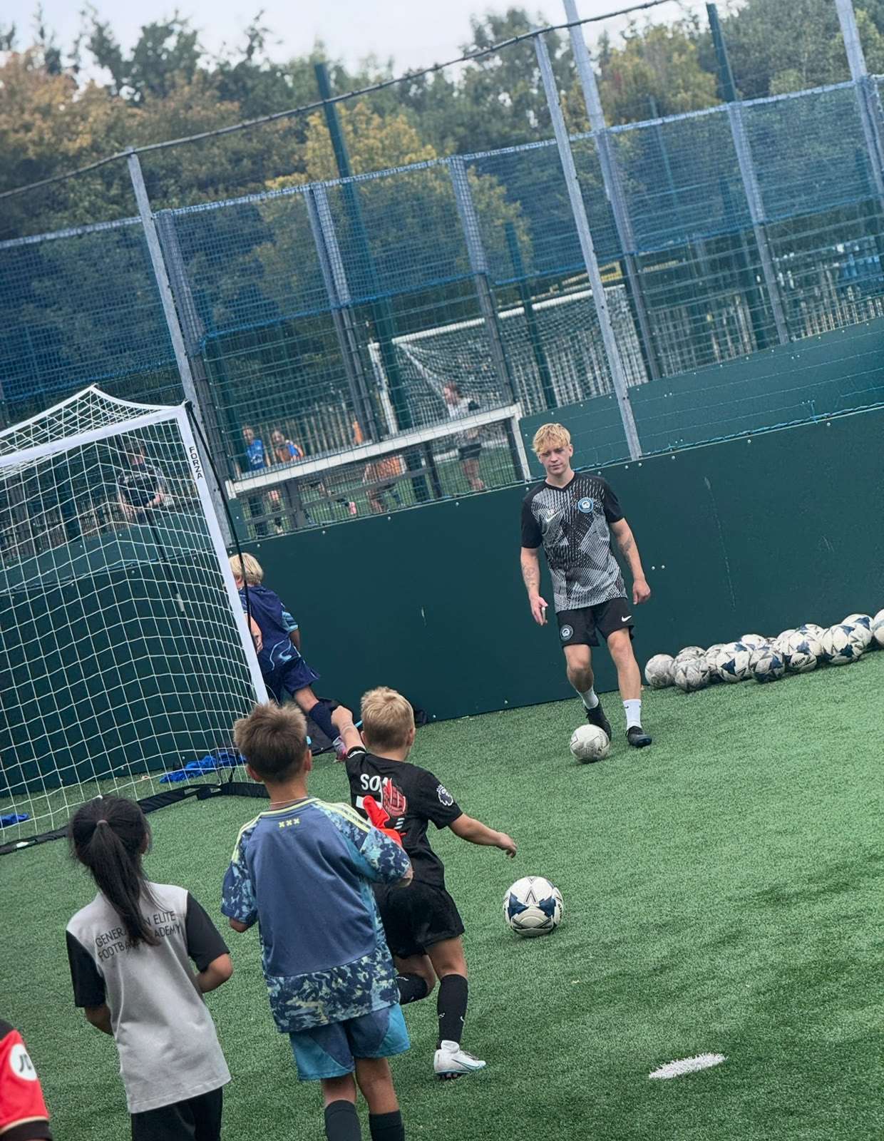 Children enjoying a kickabout during morning free play