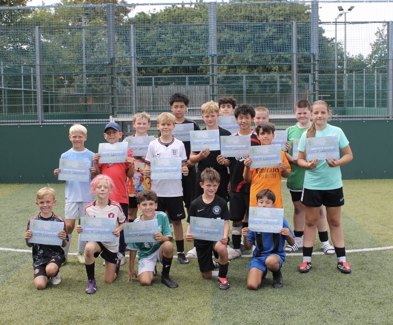The whole Bournemouth Ballers camp together with their certificates at the end of a summer camp day, BH Live Pelhams